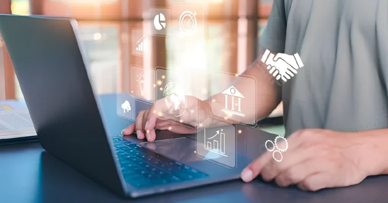 Entrepreneur using laptop with digital icons representing Virtual Business Support services