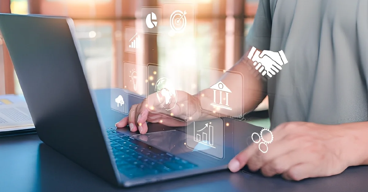 Entrepreneur using laptop with digital icons representing Virtual Business Support services