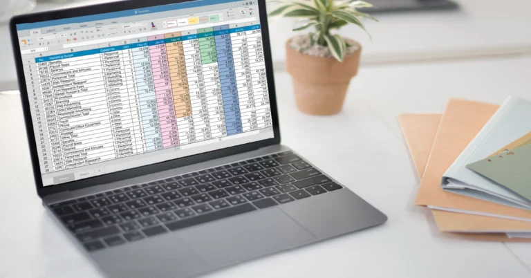 Laptop displaying a detailed Excel for Business spreadsheet with employee compensation data, symbolizing how small business owners use Excel for Business to manage financial tracking and HR operations efficiently.