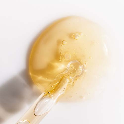 Beauty Cosmetics Blog content showing vitamin C serum texture with dropper close-up